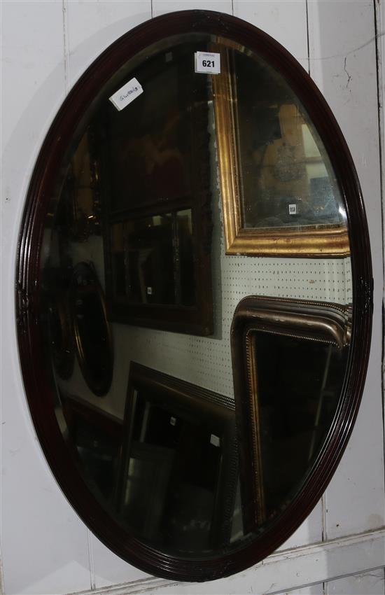 Oval bevelled wall mirror